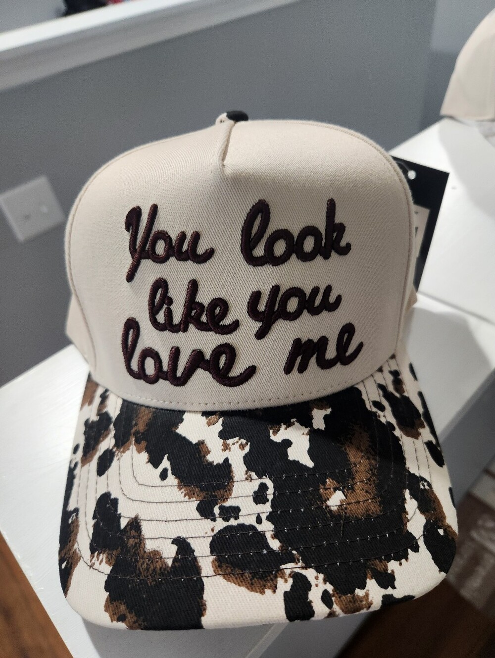 CC Boutique Cream & Brown Cowprint 'You look like you love me' Trucker Hat